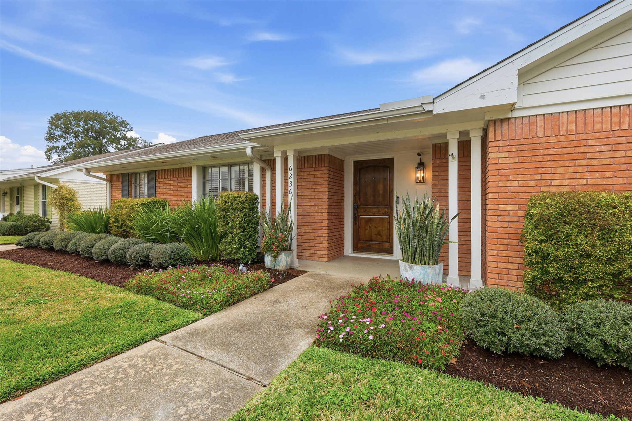 6236 Locke Lane Houston, TX 77057 - Photo 2 of 35 Welcome home! This house features well-maintained landscaping that was overhauled in 2024 to include a new Rainbird sprinkler system in both the front and backyard along with additional drainage.
