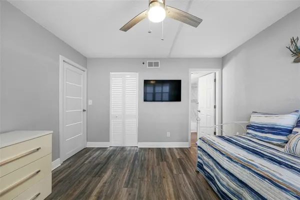 a view of a room with wooden floor and window