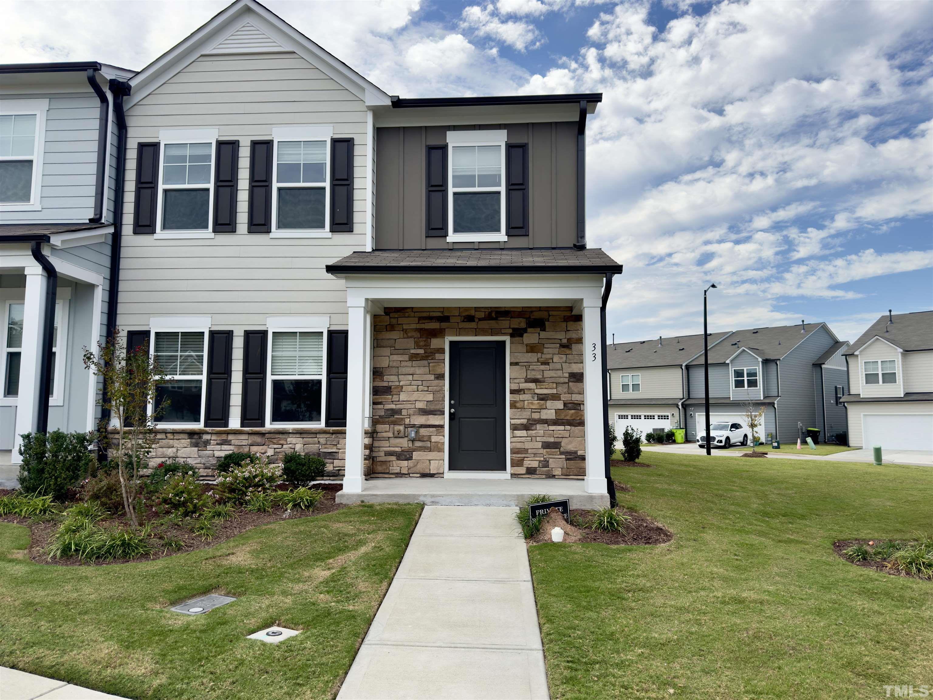 front view of a house with a yard