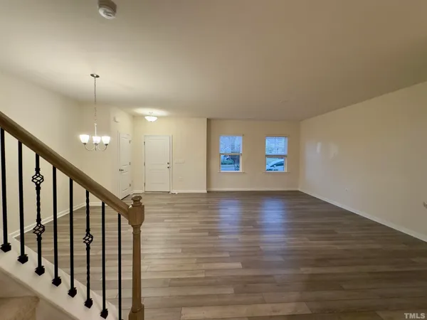 a view of an entryway with wooden floor