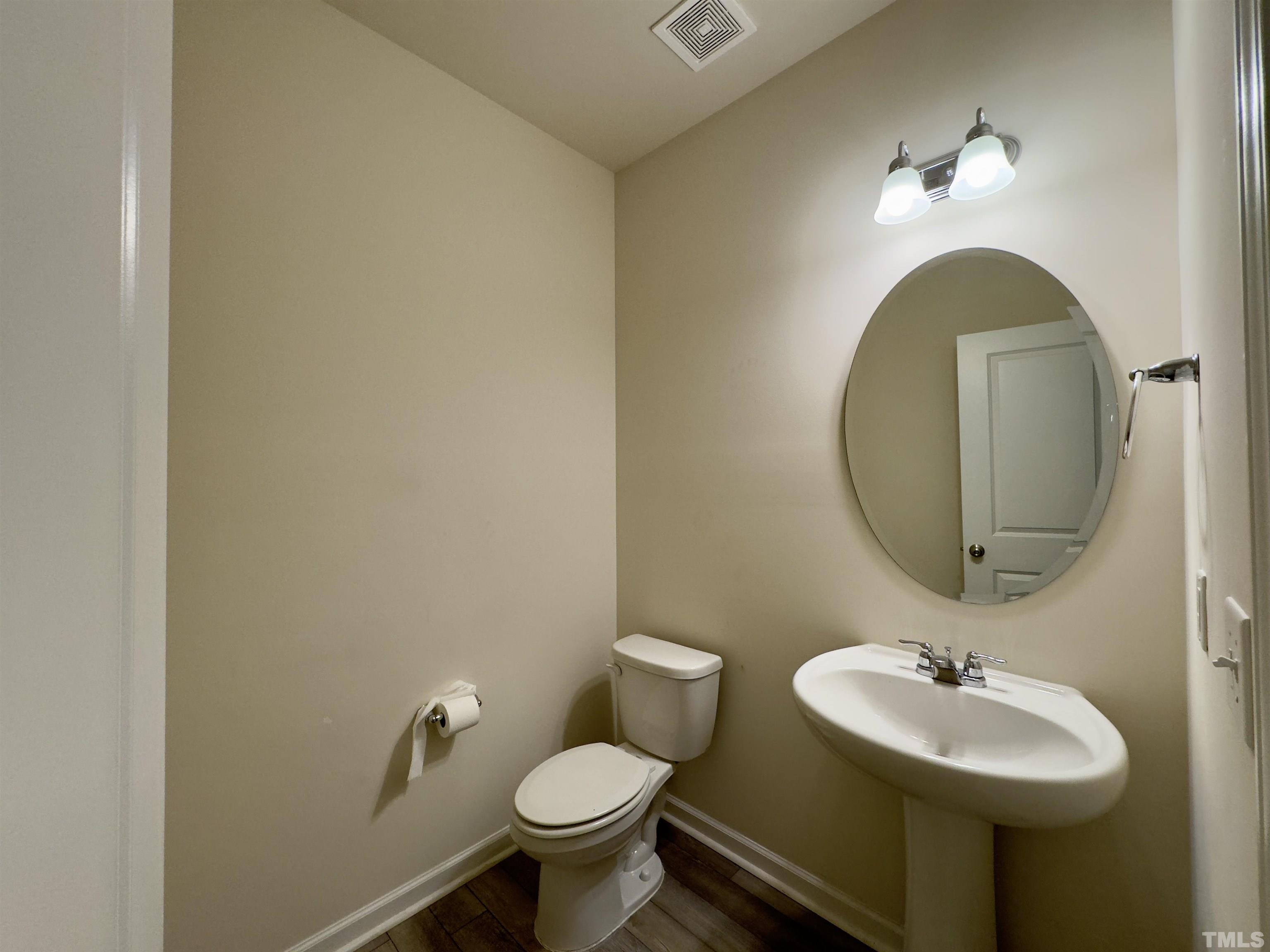 33 Rambler Lane Durham, NC 27703 - Photo 16 of 36 a bathroom with a sink and a mirror