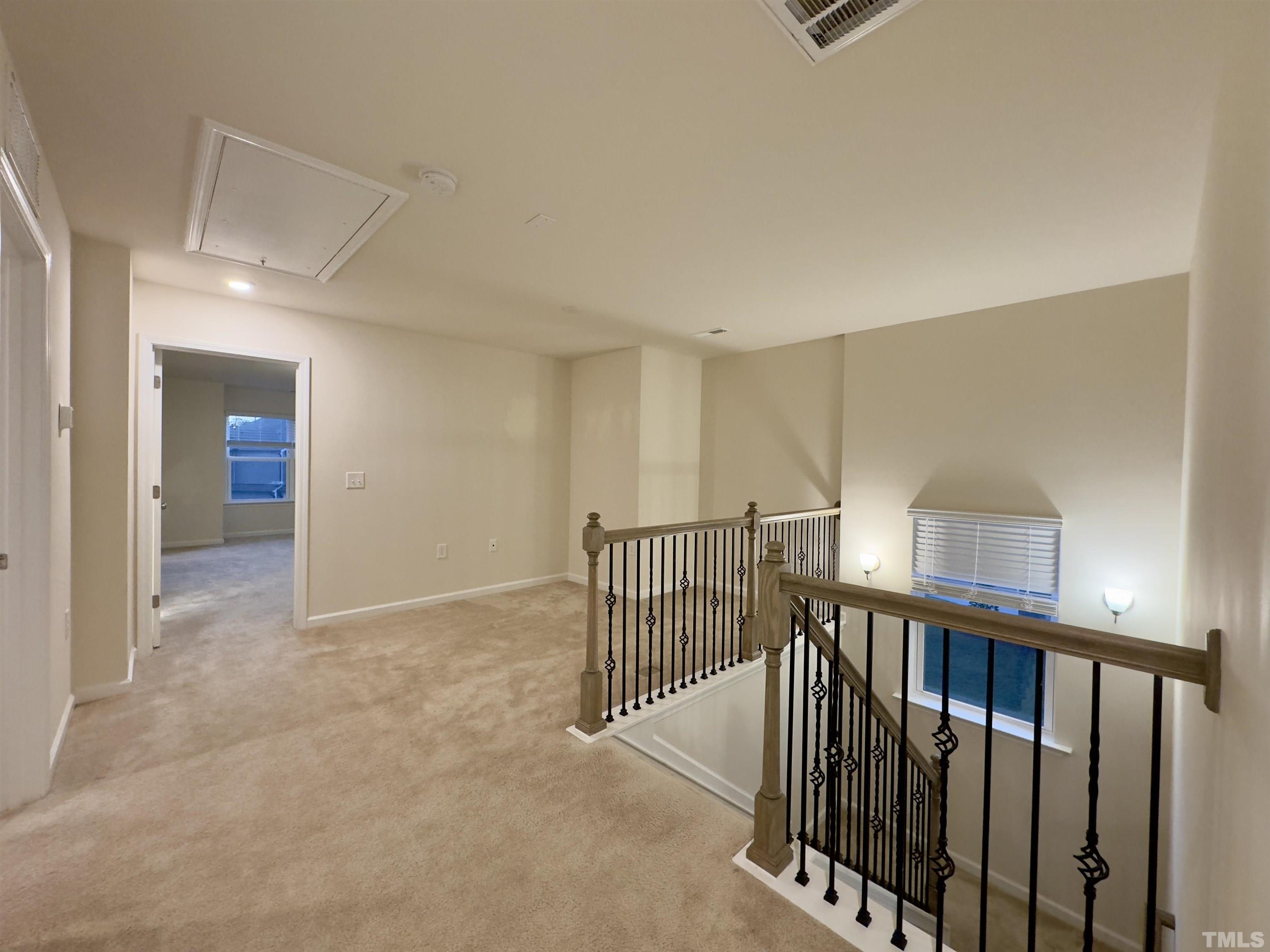33 Rambler Lane Durham, NC 27703 - Photo 17 of 36 a view of a hallway with closet and stairs