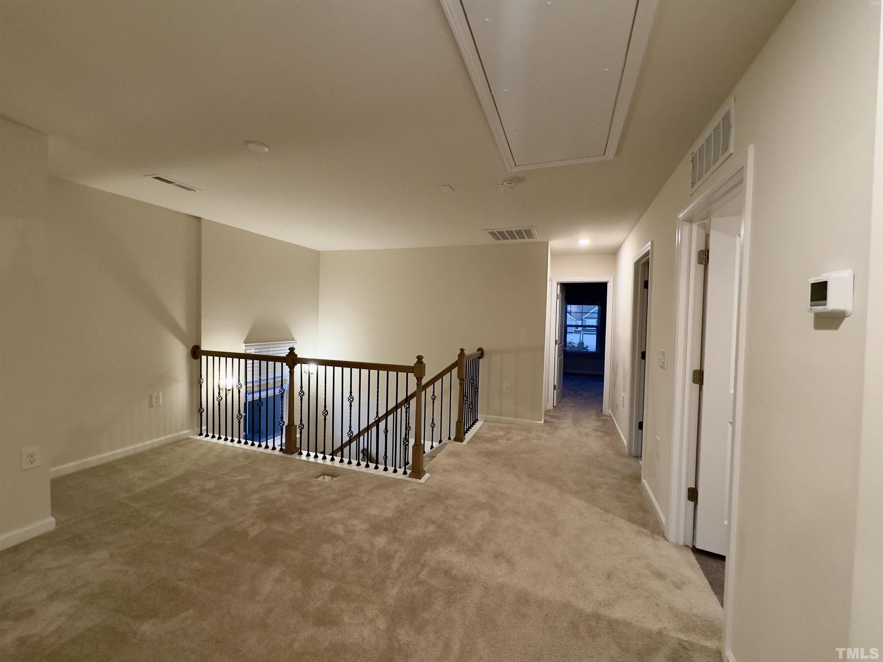 33 Rambler Lane Durham, NC 27703 - Photo 18 of 36 a view of a hallway with stairs and a window