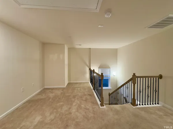 a view of a hallway with staircase