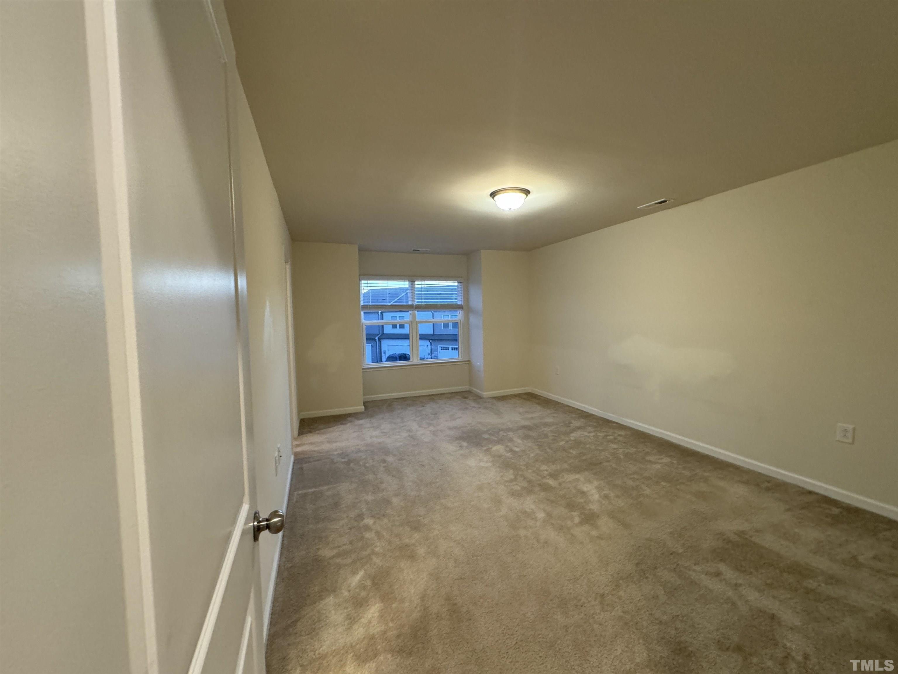 33 Rambler Lane Durham, NC 27703 - Photo 20 of 36 an empty room with windows