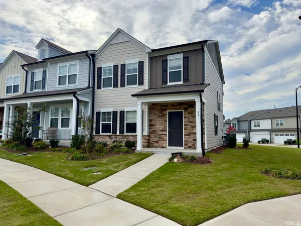 a front view of a house with a yard