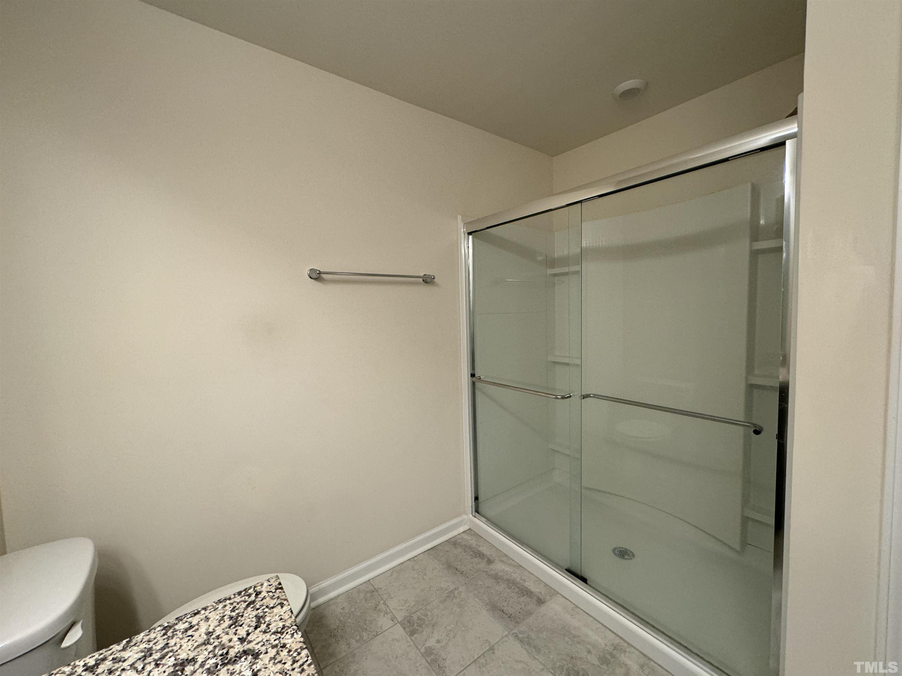 33 Rambler Lane Durham, NC 27703 - Photo 24 of 36 a bathroom with a glass shower door
