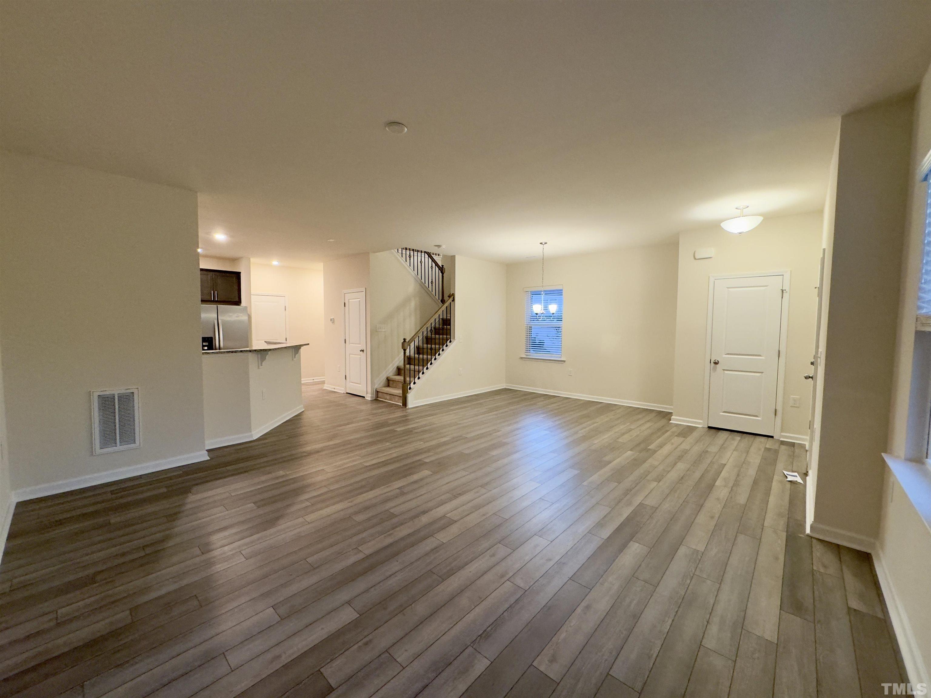 33 Rambler Lane Durham, NC 27703 - Photo 9 of 36 a view of empty room with wooden floor and fan