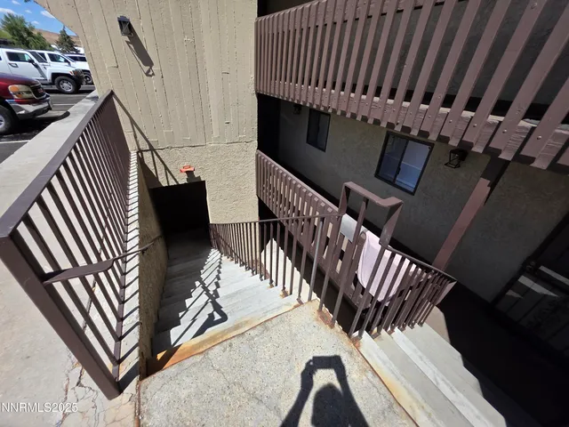 a view of stairs and furniture