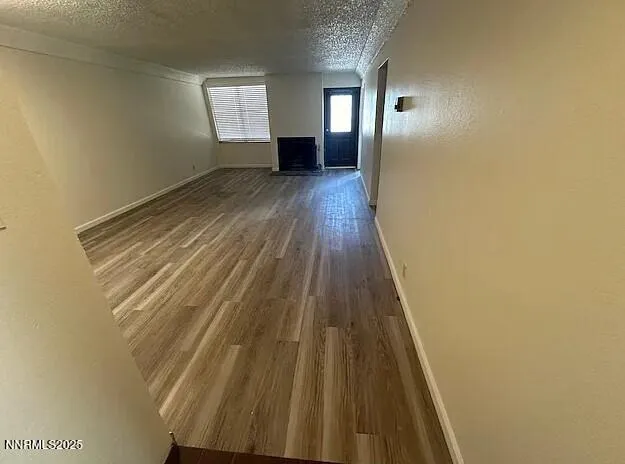 a view of wooden floor in an empty room
