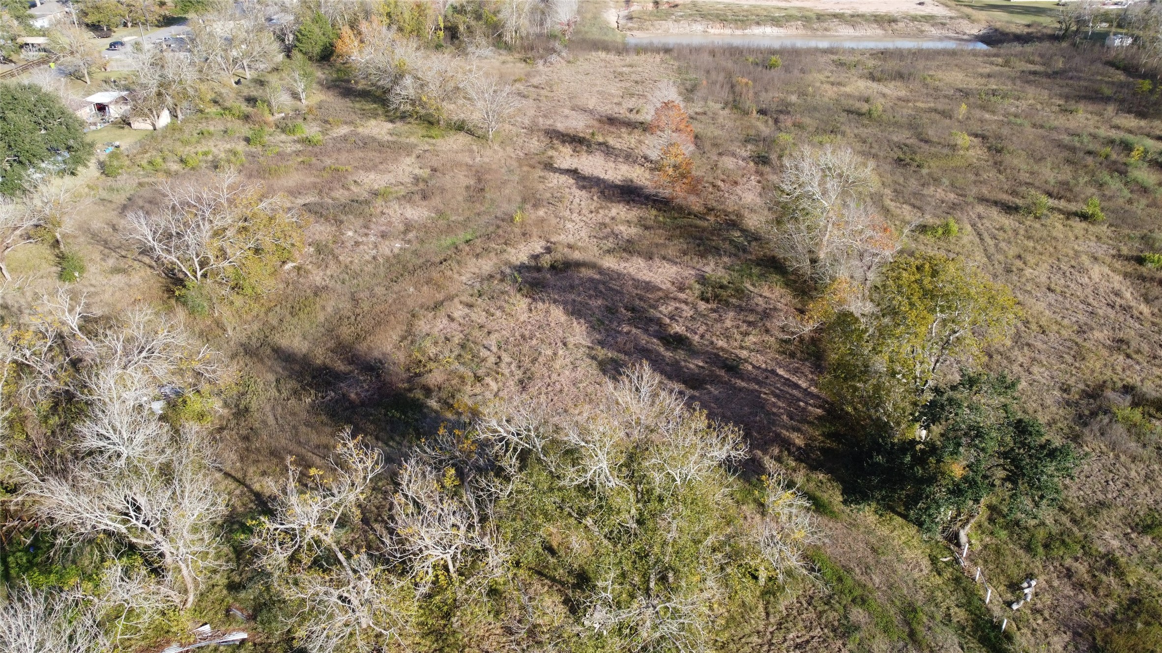 2925 West Street Rosenberg, TX 77471 - Photo 3 of 15 a view of a dry yard with green space