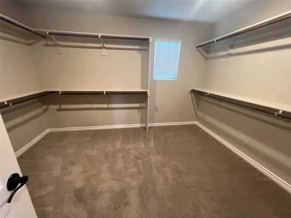 a view of an empty walk in closet