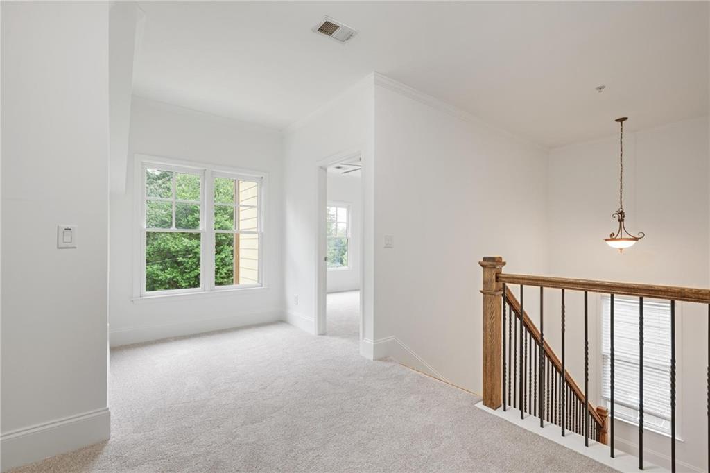 232 Hunt Street Northeast Marietta, GA 30060 - Photo 18 of 29 a view of a hallway with windows and stairs
