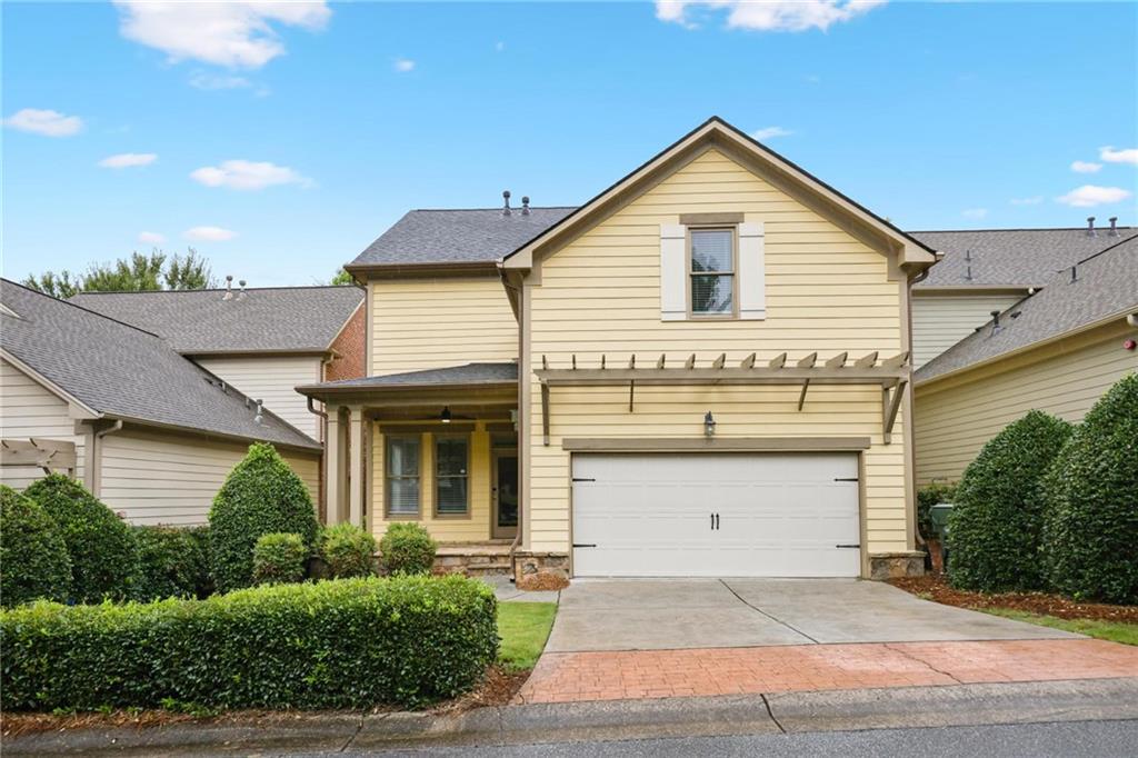 232 Hunt Street Northeast Marietta, GA 30060 - Photo 2 of 29 a front view of a house with a yard and garage
