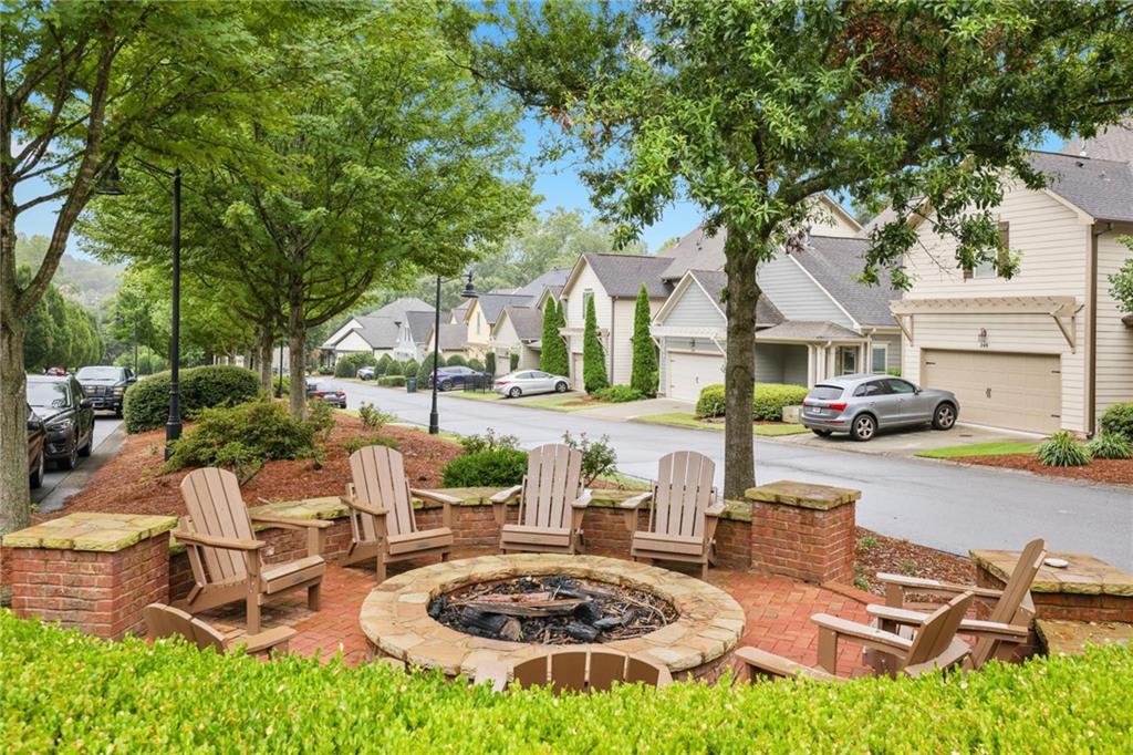232 Hunt Street Northeast Marietta, GA 30060 - Photo 29 of 29 a view of a patio with table and chairs potted plants and a large tree