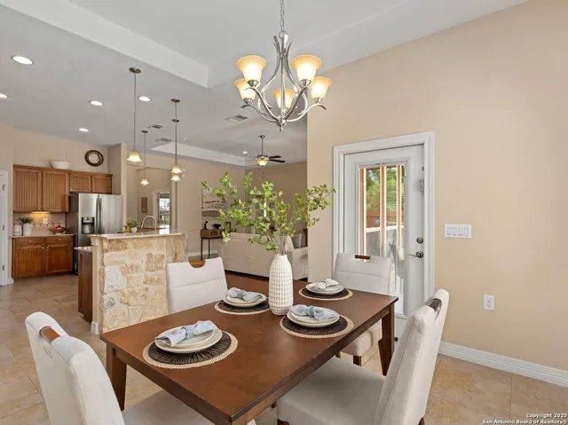 a view of kitchen with sink and refrigerator