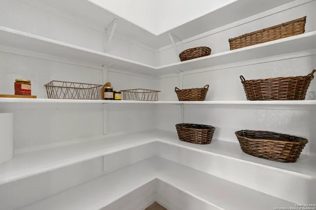 a large kitchen with kitchen island granite countertop a refrigerator a sink and a stove