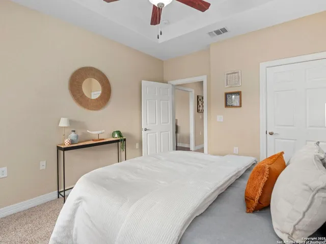 a room with a couch and a view of bathroom