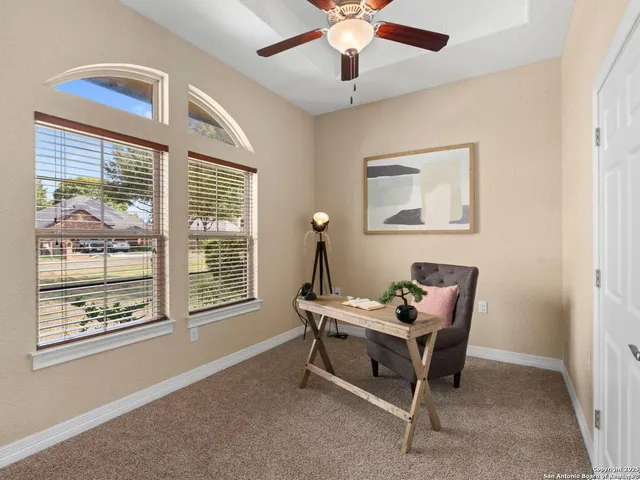 a living room with furniture and a rug