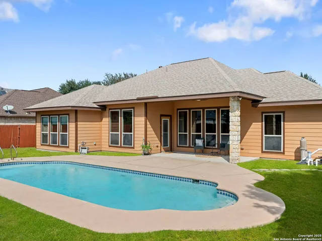 a front view of a house with a garden and porch