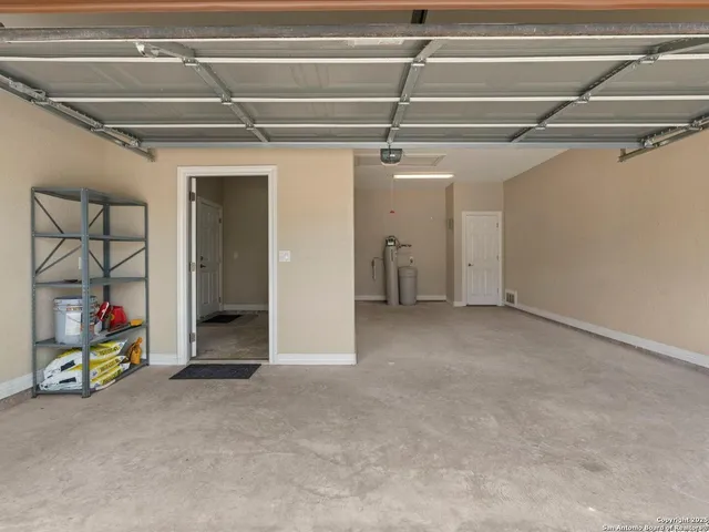 a front view of a house with yard and green space