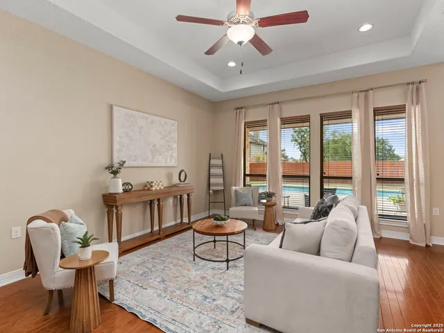 a living room with furniture and a fireplace
