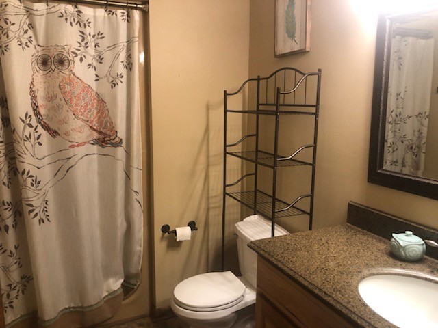 40 Smith Road Fayetteville, TN 37334 - Photo 9 of 14 a bathroom with a granite countertop sink toilet and shower