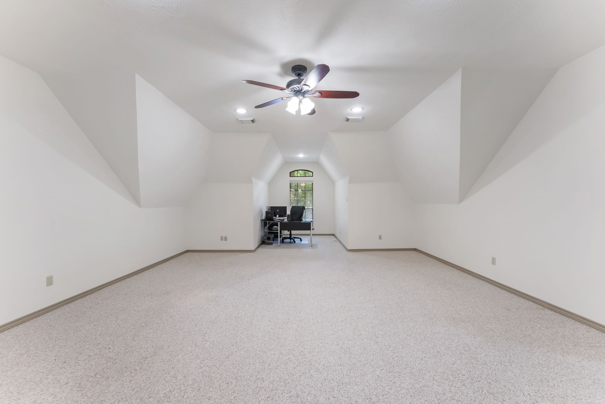 24311 Standing Oak Drive Spring, TX 77389 - Photo 22 of 42 an empty room with chandelier fan and windows