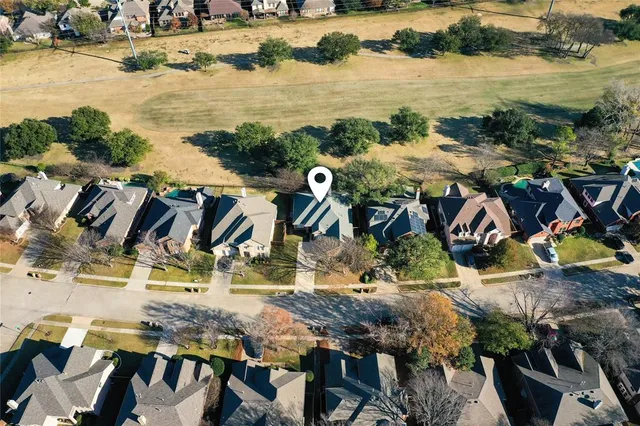 a view of a backyard with sitting area
