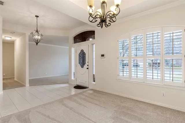 an aerial view of residential houses with city view
