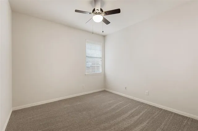 a bathroom with a granite countertop sink mirror and double