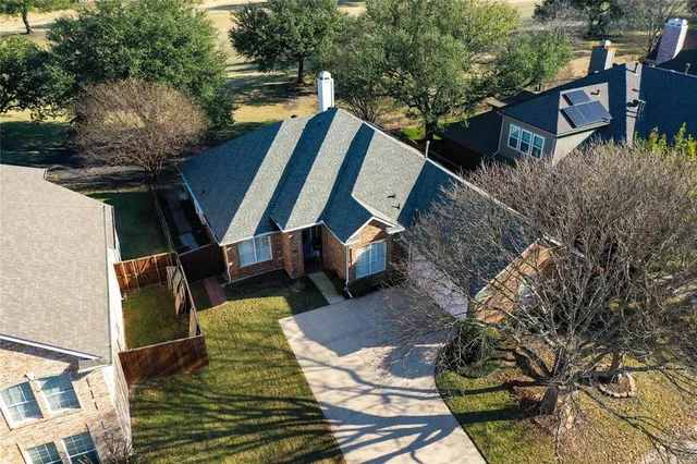 a view of a house with a street