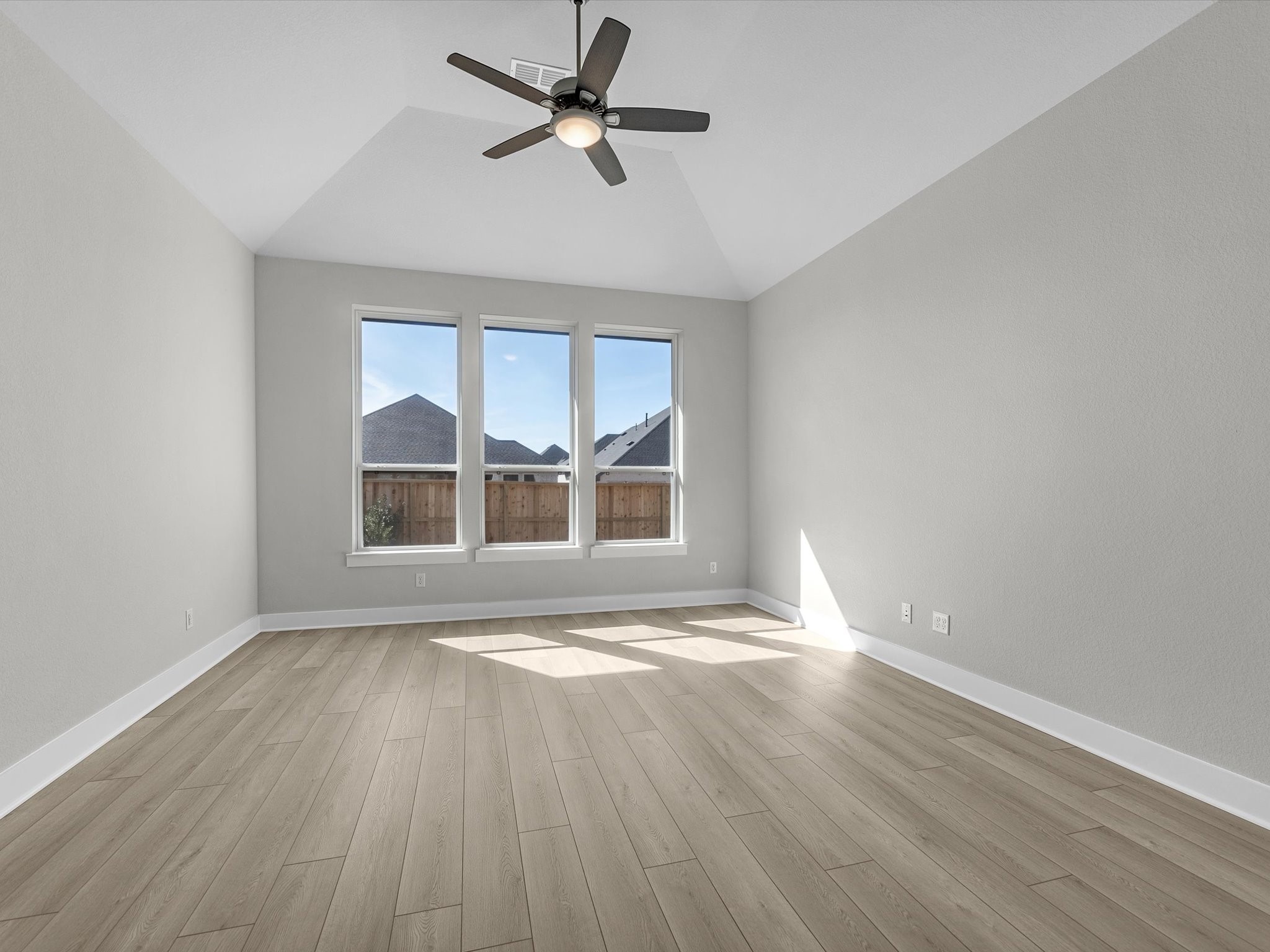 7922 Antler Rdg Drive Fulshear, TX 77441 - Photo 11 of 31 a view of empty room with wooden floor and fan