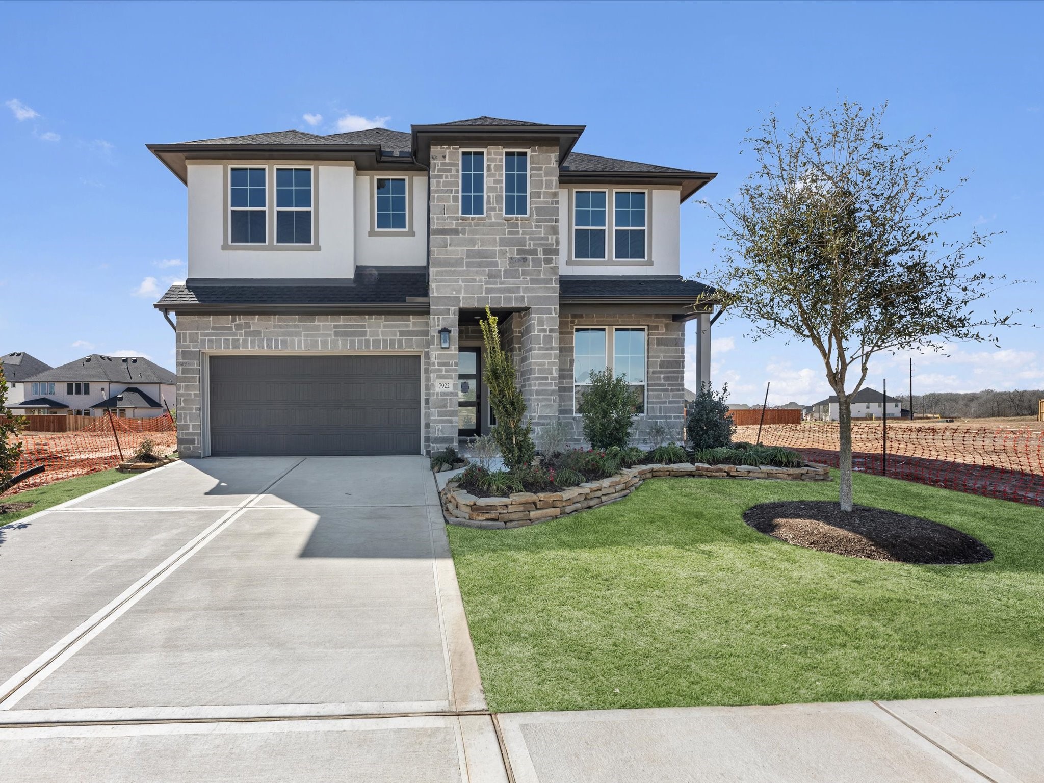 7922 Antler Rdg Drive Fulshear, TX 77441 - Photo 22 of 31 a front view of a house with a yard and garage