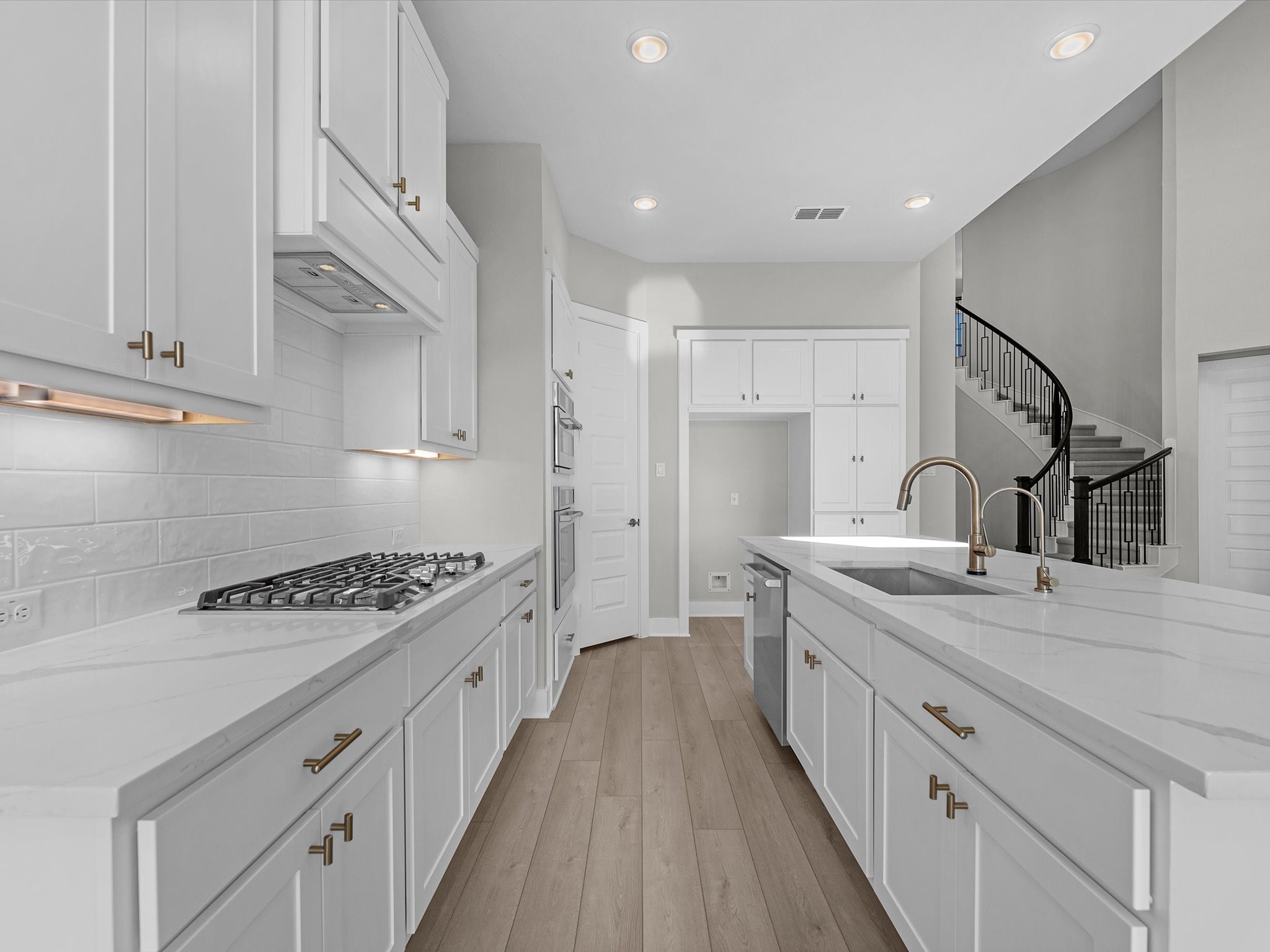 7922 Antler Rdg Drive Fulshear, TX 77441 - Photo 3 of 31 a kitchen with stainless steel appliances granite countertop a sink stove and cabinets