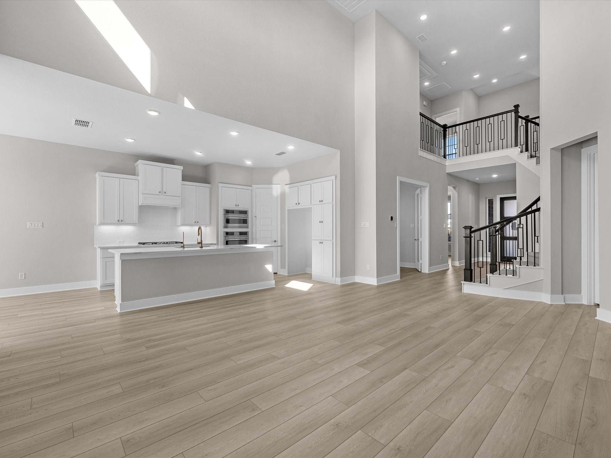 7922 Antler Rdg Drive Fulshear, TX 77441 - Photo 8 of 31 a view of kitchen and kitchen with granite countertop a stove top oven