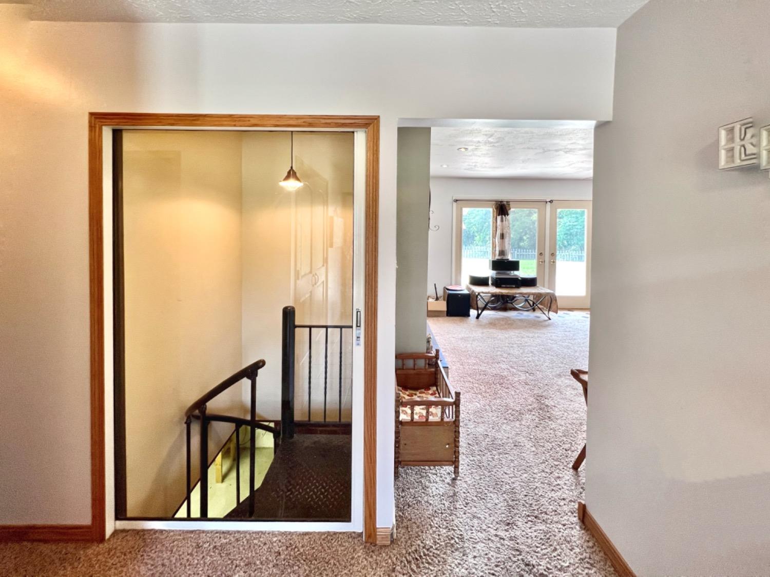 16562 Highway 250 Rising Sun, IN 47040 - Photo 45 of 70 Unique spiral staircase with a glass pocket door to the basement that has a fireplace and plumbed for a bath.