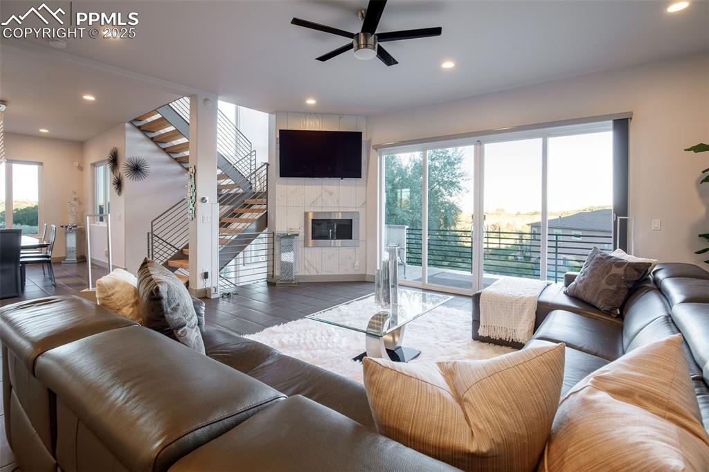 162 Crystal Valley Road Manitou Springs, CO 80829 - Photo 17 of 48 a living room with furniture and a flat screen tv
