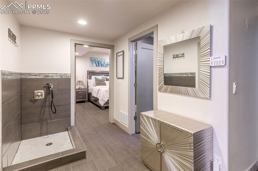 162 Crystal Valley Road Manitou Springs, CO 80829 - Photo 22 of 48 a bathroom with a glass door shower and a sink