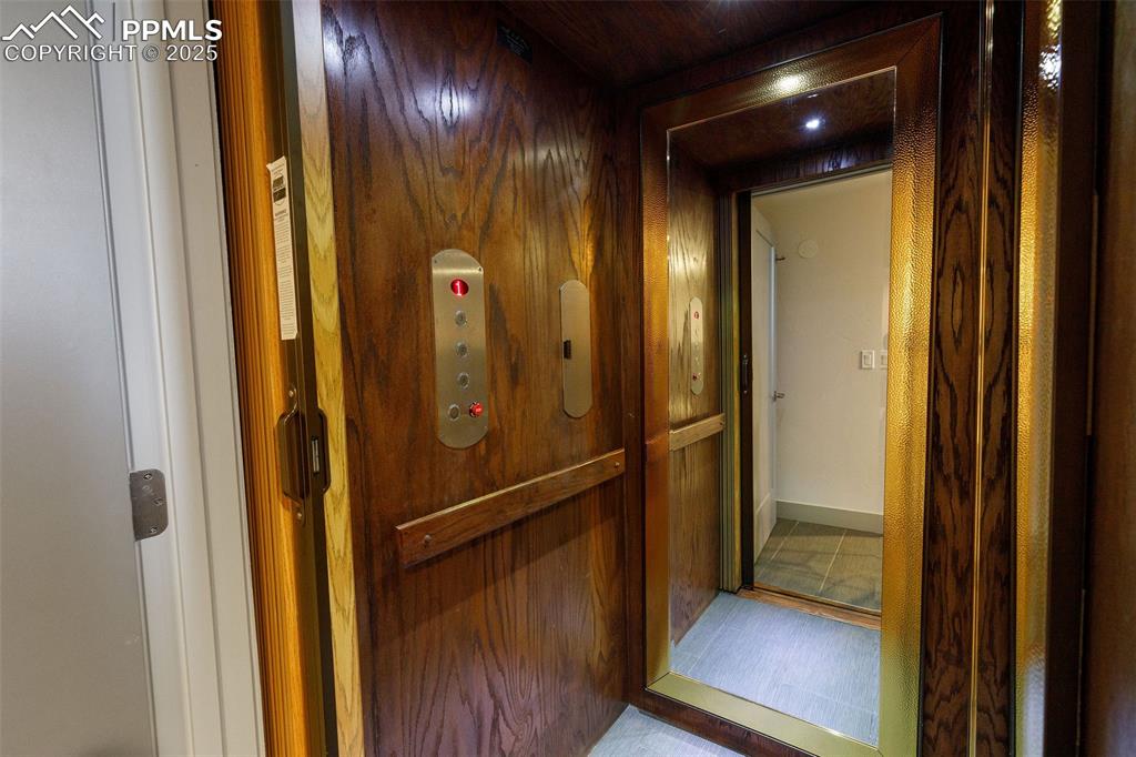 162 Crystal Valley Road Manitou Springs, CO 80829 - Photo 23 of 48 a view of a hallway with wooden floor