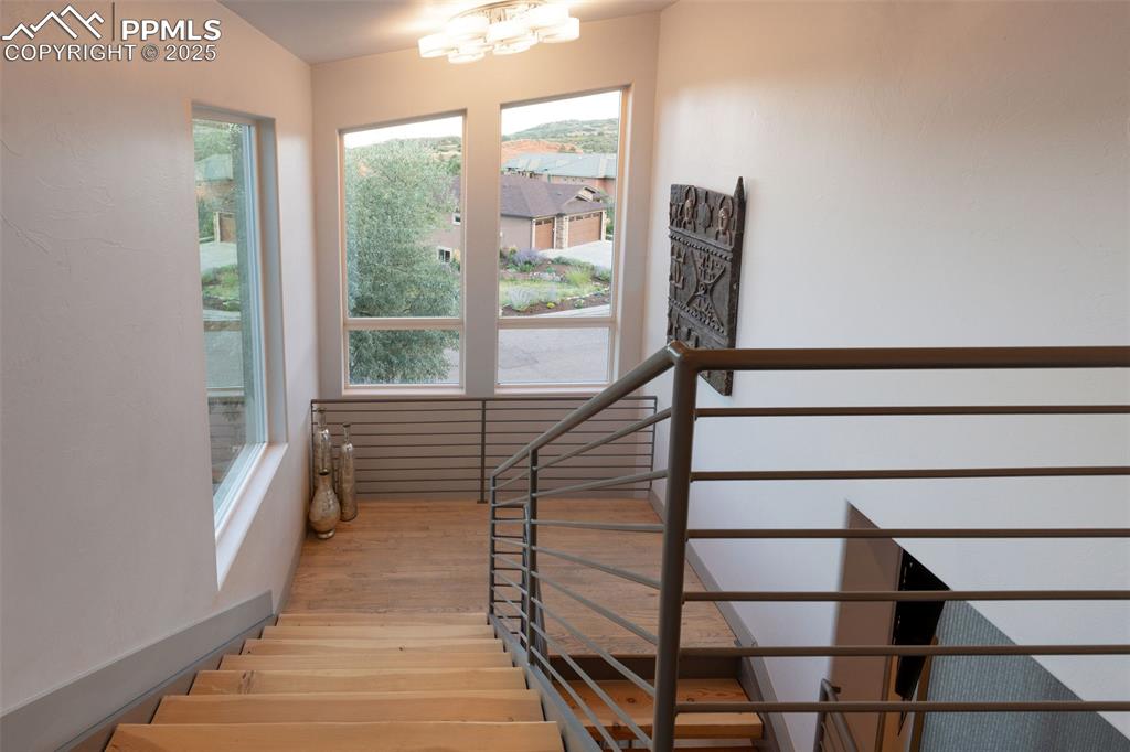 162 Crystal Valley Road Manitou Springs, CO 80829 - Photo 28 of 48 a view of entryway with wooden floor and a front door