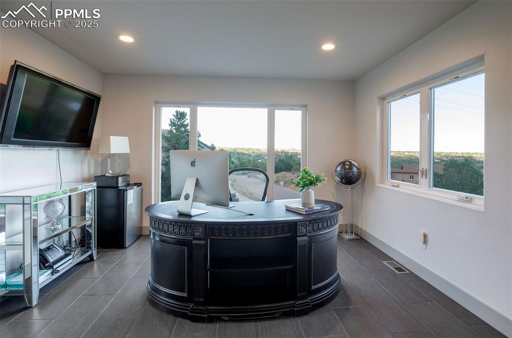 162 Crystal Valley Road Manitou Springs, CO 80829 - Photo 29 of 48 a living room with furniture and a flat screen tv