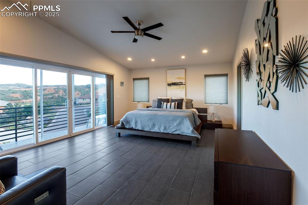 162 Crystal Valley Road Manitou Springs, CO 80829 - Photo 32 of 48 a bedroom with furniture and a large window
