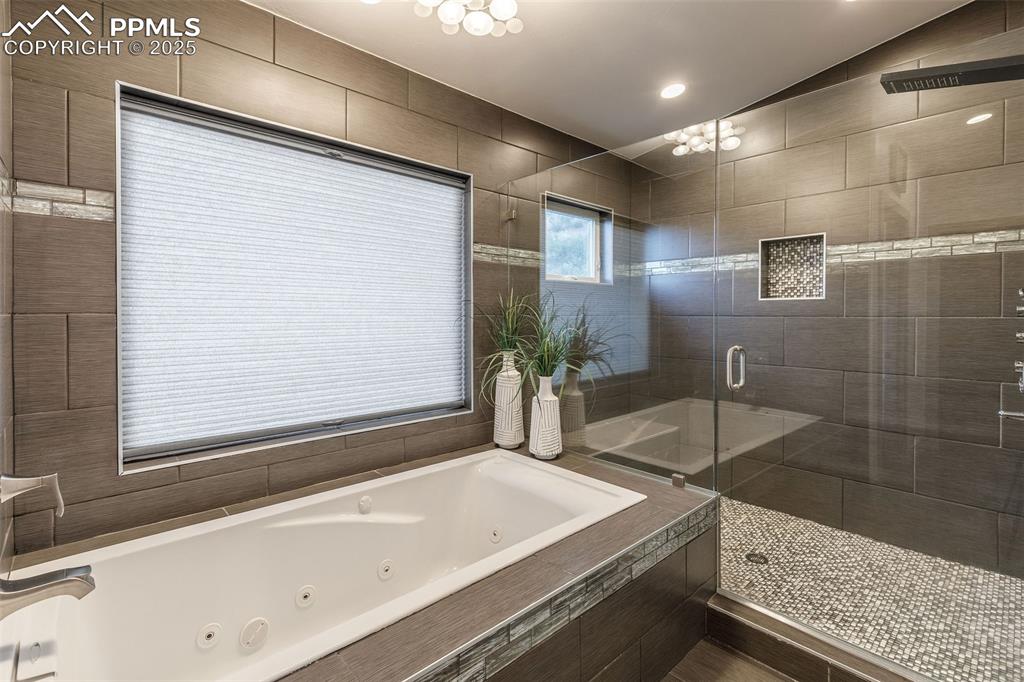 162 Crystal Valley Road Manitou Springs, CO 80829 - Photo 37 of 48 a bathroom with a bathtub and a sink