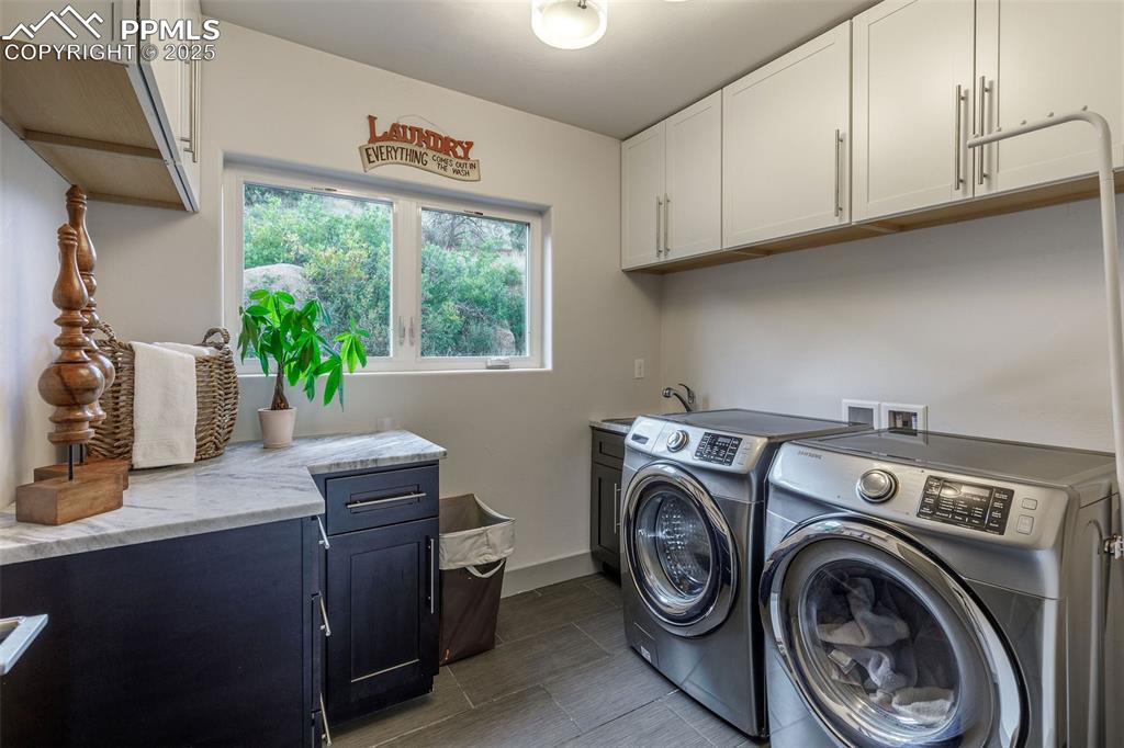 162 Crystal Valley Road Manitou Springs, CO 80829 - Photo 41 of 48 a view of storage and utility room with washer and dryer