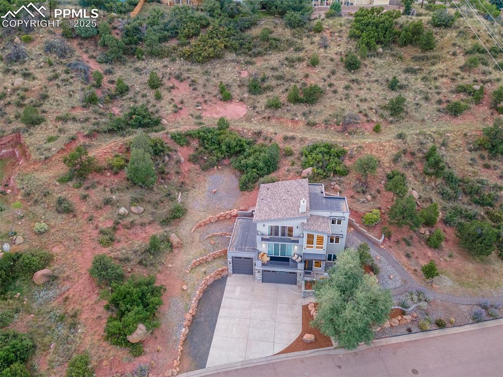 162 Crystal Valley Road Manitou Springs, CO 80829 - Photo 46 of 48 an aerial view of a house with a yard