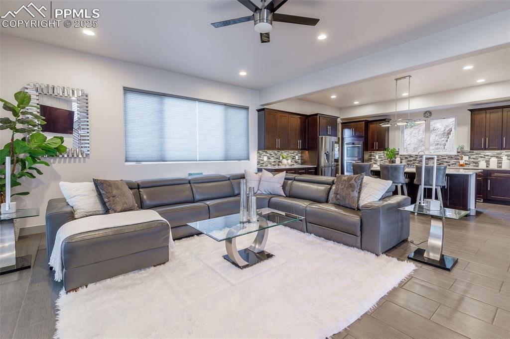 162 Crystal Valley Road Manitou Springs, CO 80829 - Photo 9 of 48 a living room with furniture and a view of kitchen
