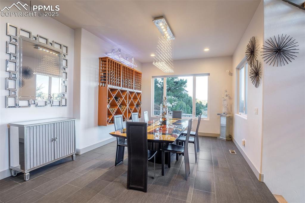 162 Crystal Valley Road Manitou Springs, CO 80829 - Photo 10 of 48 a view of a dining room with furniture window and outside view