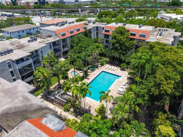 an aerial view of a house with swimming pool