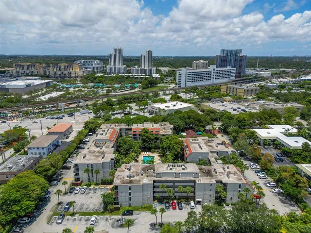 an aerial view of multiple houses with outdoor space